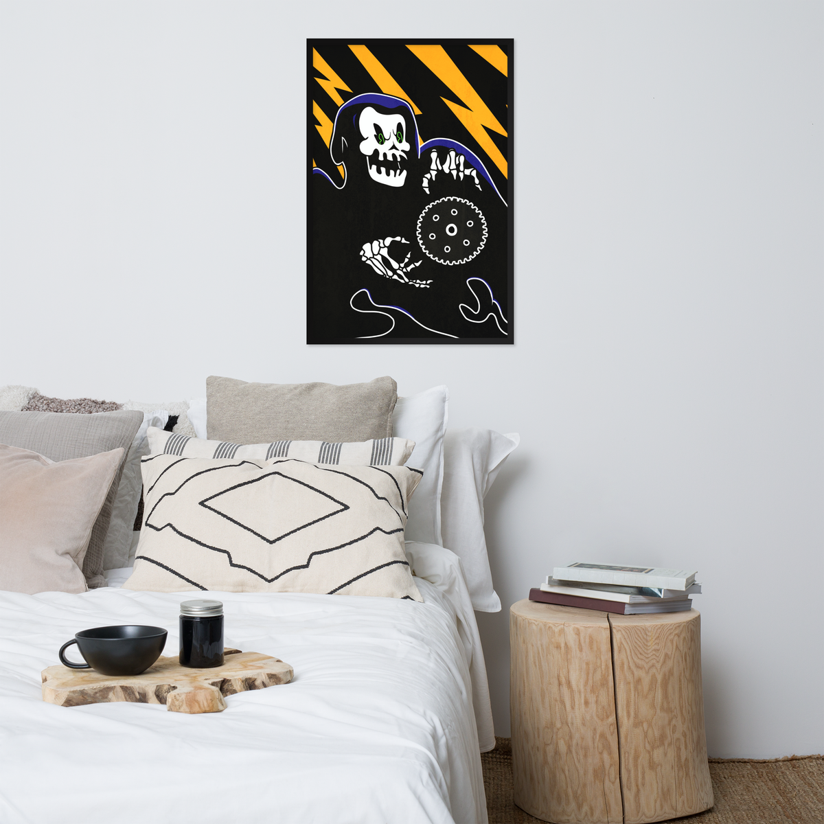 A framed wall art print featuring a black background with yellow lightning bolts, a white skull, and abstract line drawings, displayed above a bed in a modern bedroom setting.