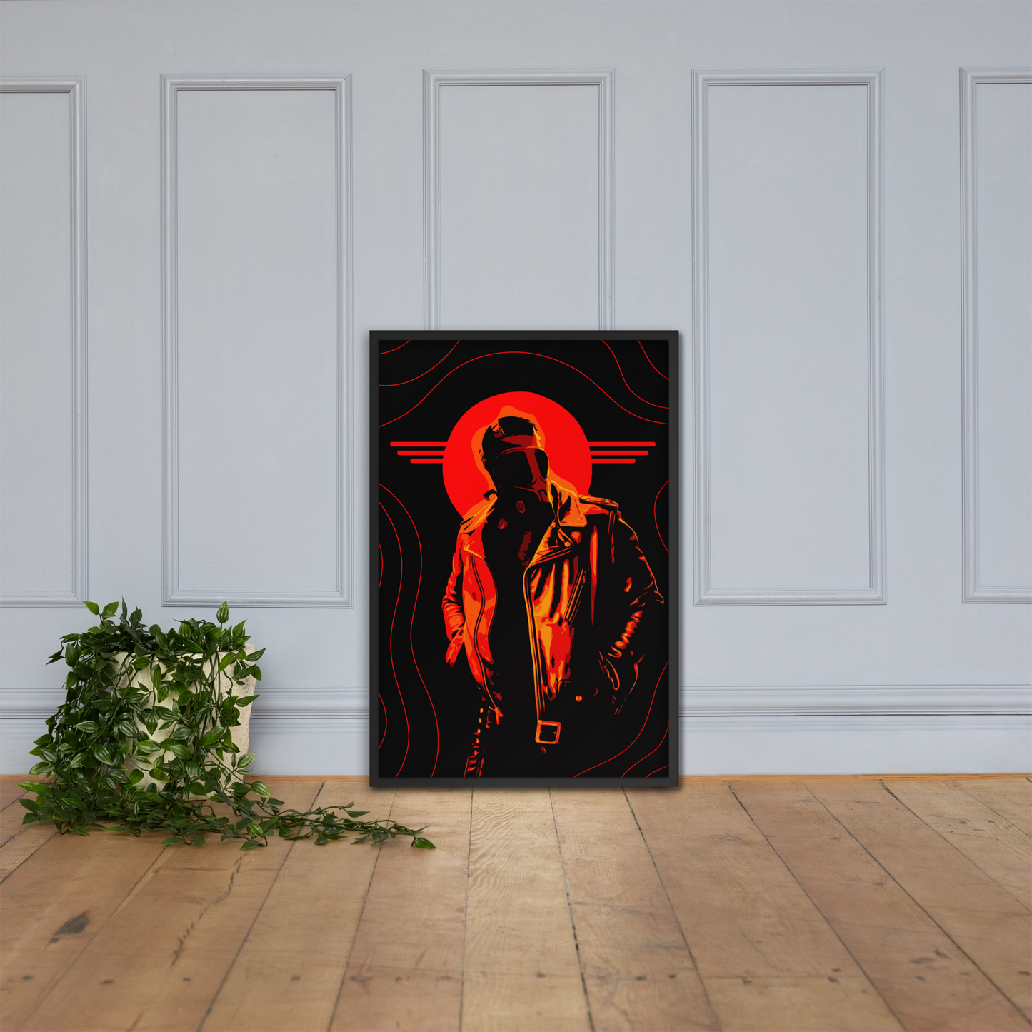Framed artwork of a silhouette with a red halo on a black background, leaning against a white paneled wall.